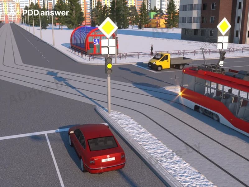 В показанной ситуации (на светофоре включён жёлтый мигающий сигнал) при движении прямо водитель легкового автомобиля: