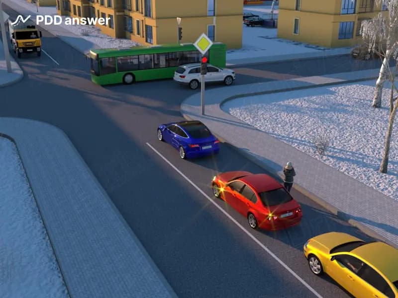 Водитель красного легкового автомобиля занял соответствующее положение на проезжей части дороги перед поворотом налево. Нарушил ли он Правила дорожного движения, высадив пассажира по его просьбе во время ожидания разрешающего сигнала светофора?