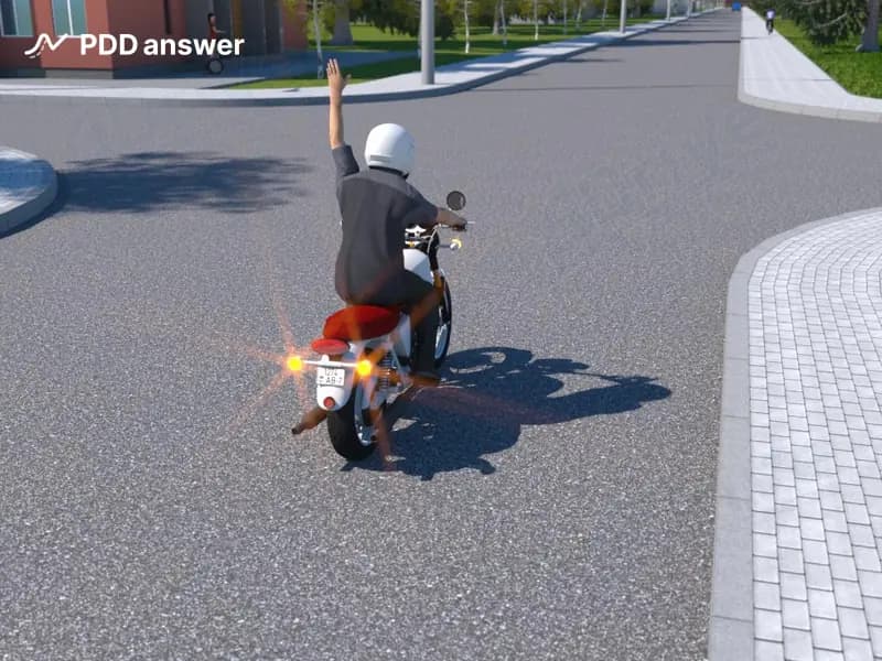 О чём информирует участников дорожного движения сигнал, который подаёт рукой водитель движущегося впереди мотоцикла (поднятая вверх левая рука)?