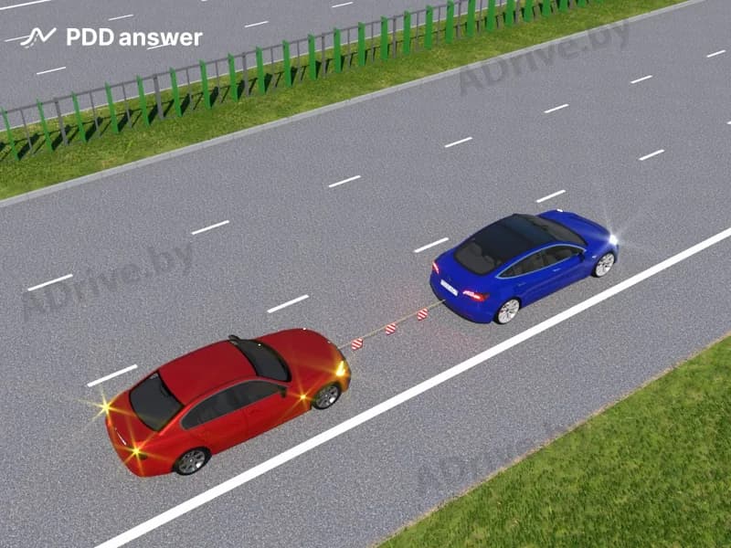 Каким образом должна быть осуществлена буксировка неисправного транспортного средства по автомагистрали?