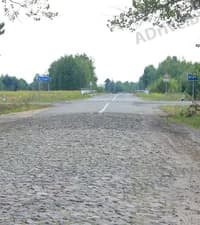 Считается ли дорожное покрытие из булыжника усовершенствованным?