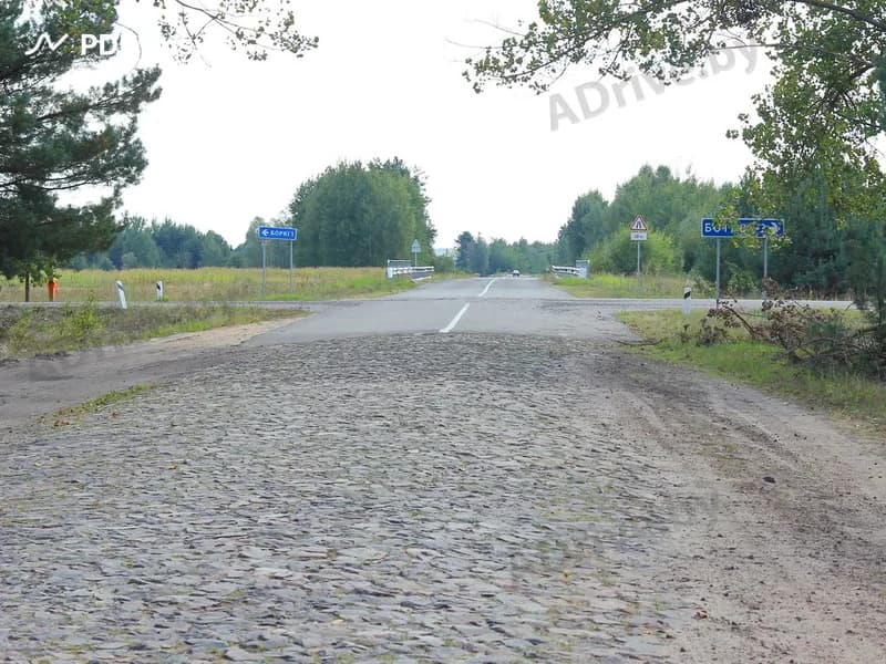 Считается ли дорожное покрытие из булыжника усовершенствованным?