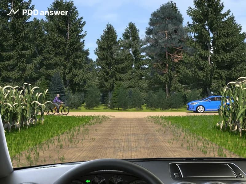 Как Вам следует поступить, приближаясь по дороге с грунтовым покрытием к необозначенному перекрёстку с дорогой с гравийным покрытием?