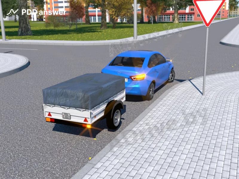 При повороте направо на перекрёстке у автомобиля с прицепом возникает опасность смещения прицепа: