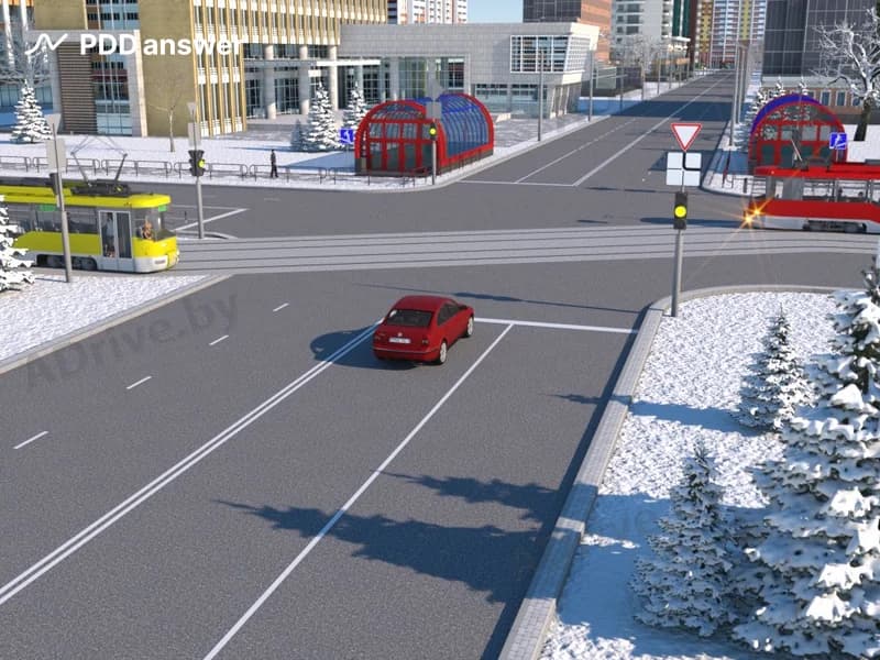 В показанной ситуации (на светофоре включён жёлтый мигающий сигнал) при движении прямо водитель легкового автомобиля: