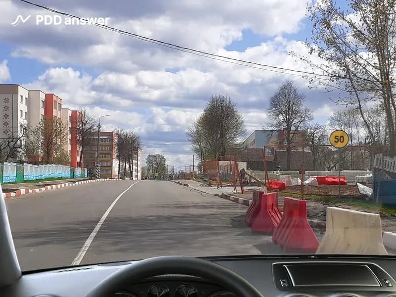 С какой максимальной скоростью Вам разрешено продолжить движение после проезда показанного дорожного знака, управляя легковым автомобилем, в населённом пункте?