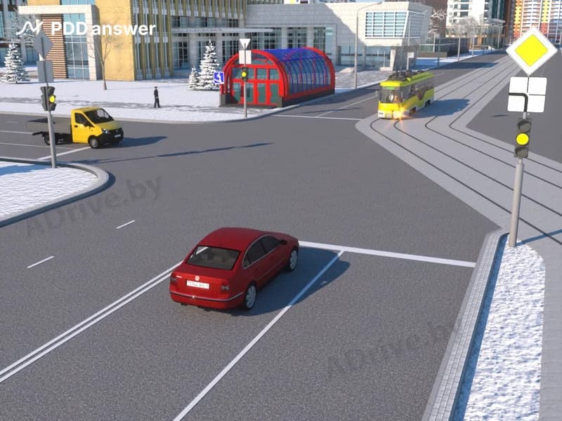 В показанной ситуации (на светофоре включён жёлтый мигающий сигнал) при движении прямо водитель легкового автомобиля: