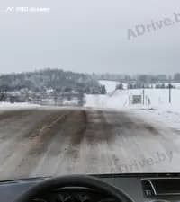 Что необходимо сделать при подъезде зимой к крутому спуску, если дорожное покрытие скользкое?
